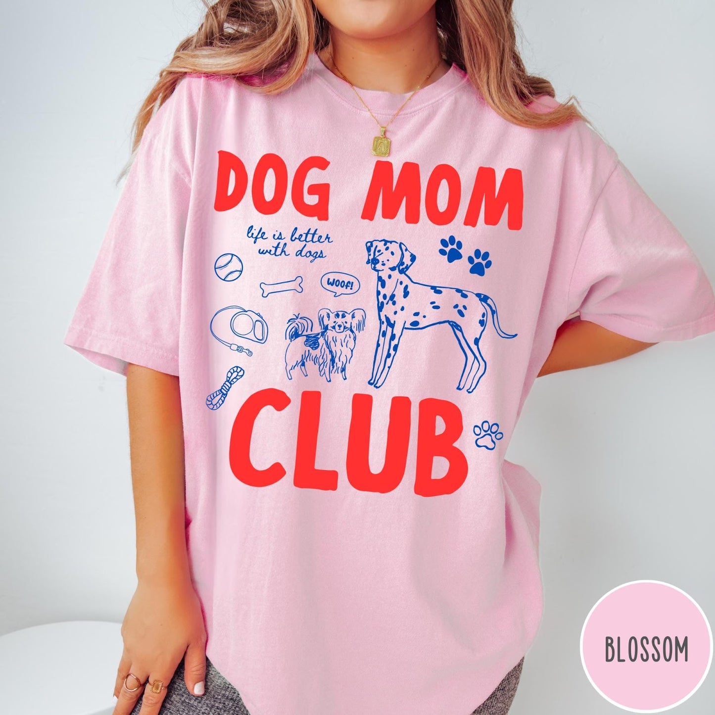 Comfort Colors tee in Blossom featuring Dog Mom Club graphic with dalmatian, small dog, and pet accessories