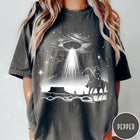 Comfort Colors tee in Pepper featuring western graphic style with a cowboy riding a horse under a UFO