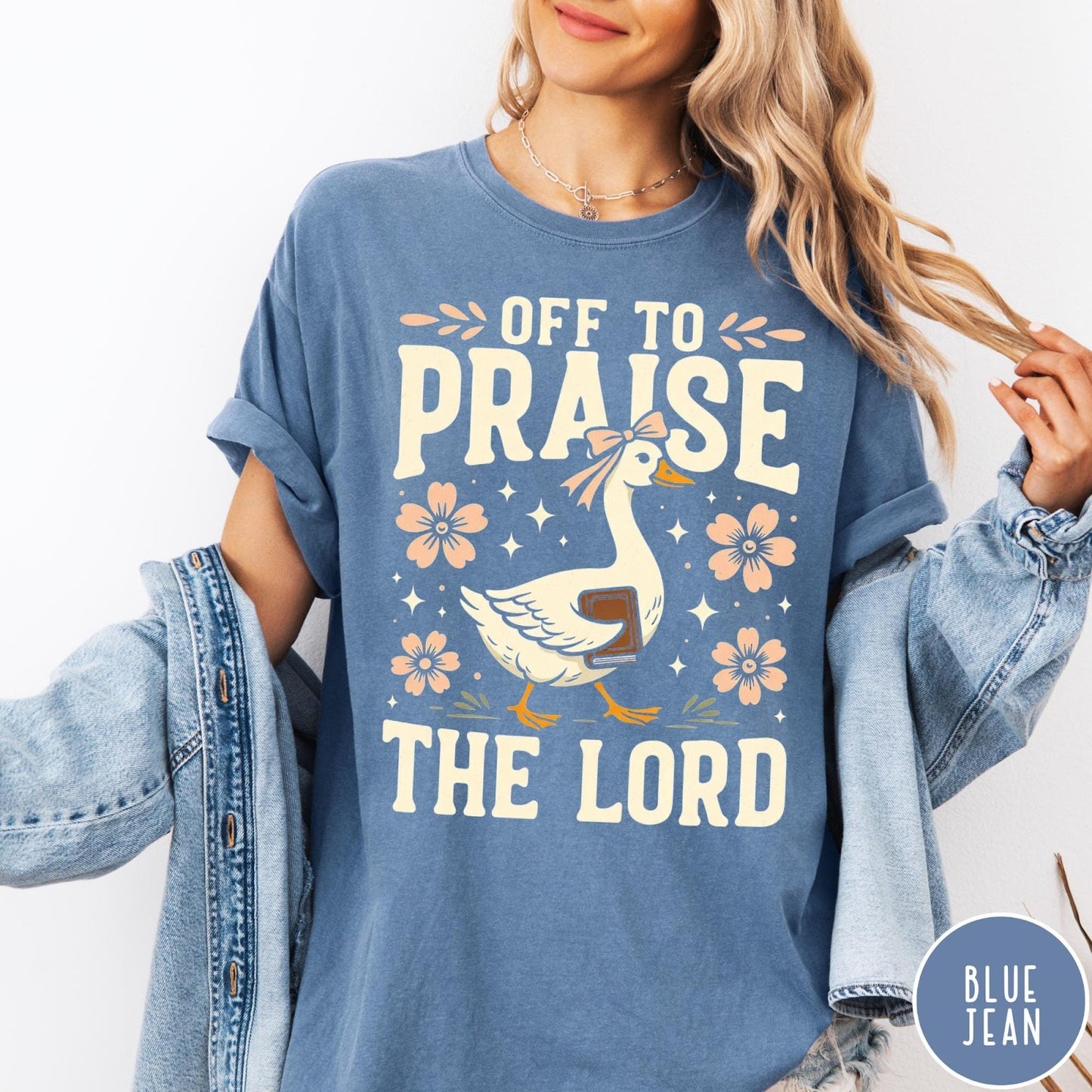 Comfort Colors tee in Blue Jean featuring screen print style graphic of a goose carrying a book