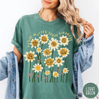Comfort Colors tee in Light Green featuring daisy graphic with positive affirmations and encouraging words about kindness