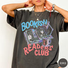 Comfort Colors tee in Pepper featuring illustrated book graphic with a lamp and a coffee mug design
