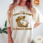 Comfort Colors tee in Ivory featuring cute graphic style illustration of a hedgehog wearing a cowboy hat