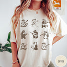 Comfort Colors tee in Ivory featuring vintage style graphic of various animals playing different musical instruments