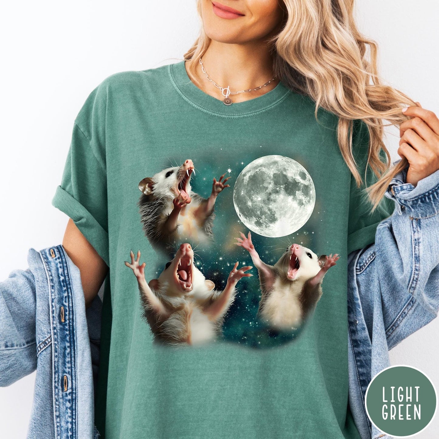 Comfort Colors tee in Light Green featuring vintage graphic style with three screaming possums reaching for the moon