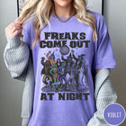 Comfort Colors tee in Violet featuring retro disco style graphic of dancing monsters and a disco ball