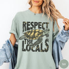 Comfort Colors tee in Bay featuring vintage style sea turtle graphic with Respect the Locals text