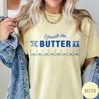 Comfort Colors tee in Butter featuring a graphic design of a butter wrapper with measurements and text.