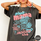 Comfort Colors tee in Pepper featuring retro style graphic with potted plants and Plant Mama Obsessed Club text