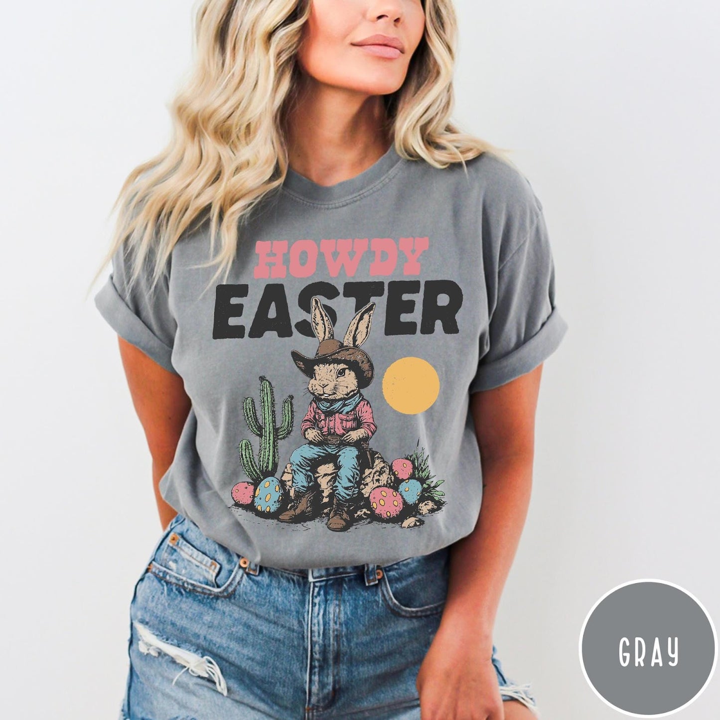 Comfort Colors tee in Gray featuring western graphic of a cowboy bunny sitting with cactus and eggs