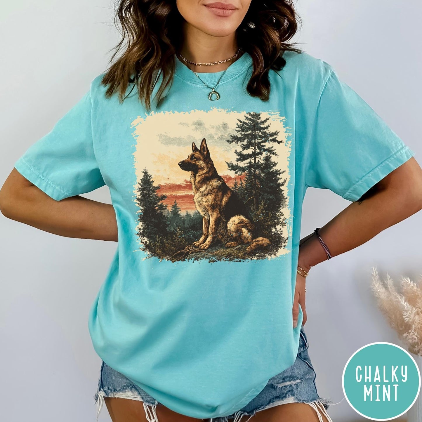 Comfort Colors tee in Chalky Mint featuring vintage style graphic of a German Shepherd sitting in a forest