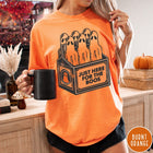 Comfort Colors tee in Burnt Orange featuring vintage style graphic of ghosts in a milk carton crate