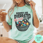 Comfort Colors tee in Island Reef featuring graphic illustration of a raccoon sitting in an Easter basket