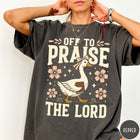Comfort Colors tee in Pepper featuring retro style graphic of a goose wearing a bow holding a book