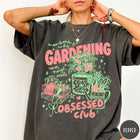 Comfort Colors tee in Pepper featuring retro graphic gardening design with tomato plant, seeds, and gardening tools