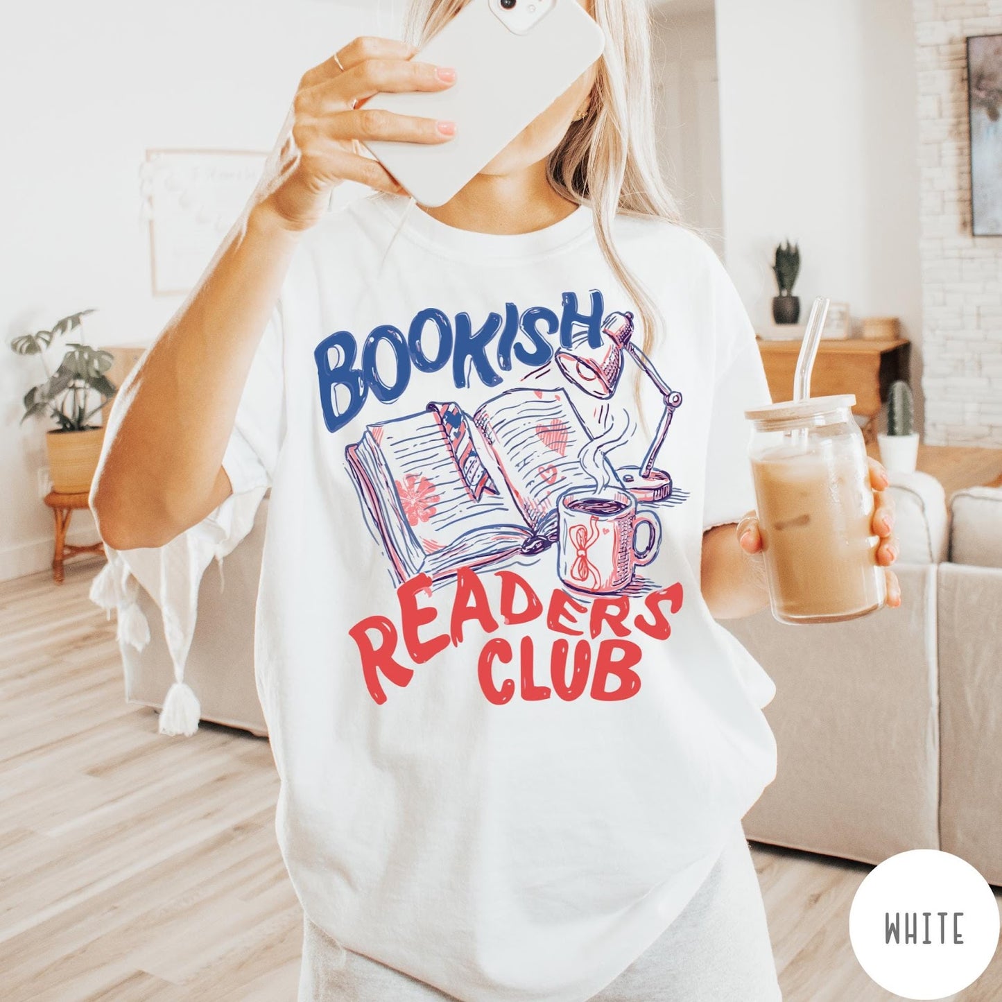 Comfort Colors tee in White featuring bookish reading graphic with open book, lamp, and coffee mug