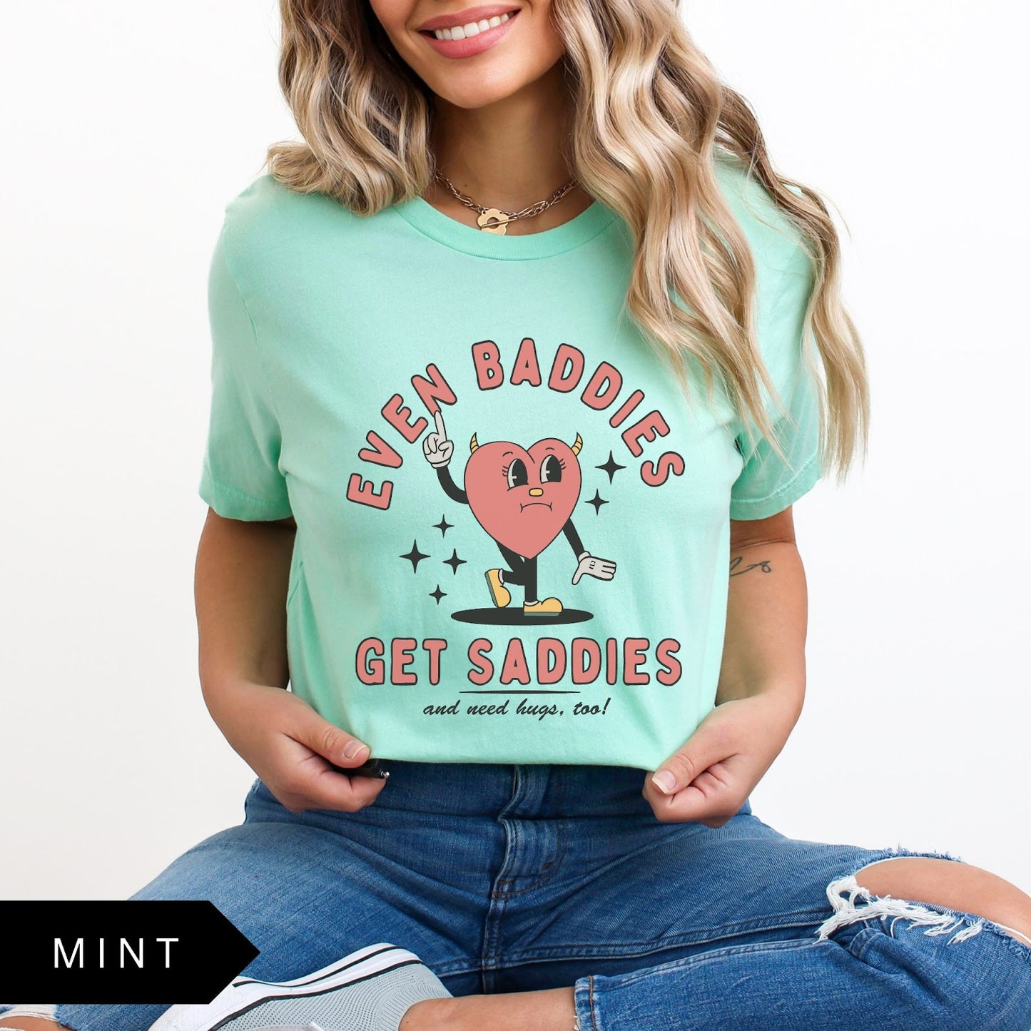 Comfort Colors tee in Mint featuring retro style sad heart character with horns and text graphic