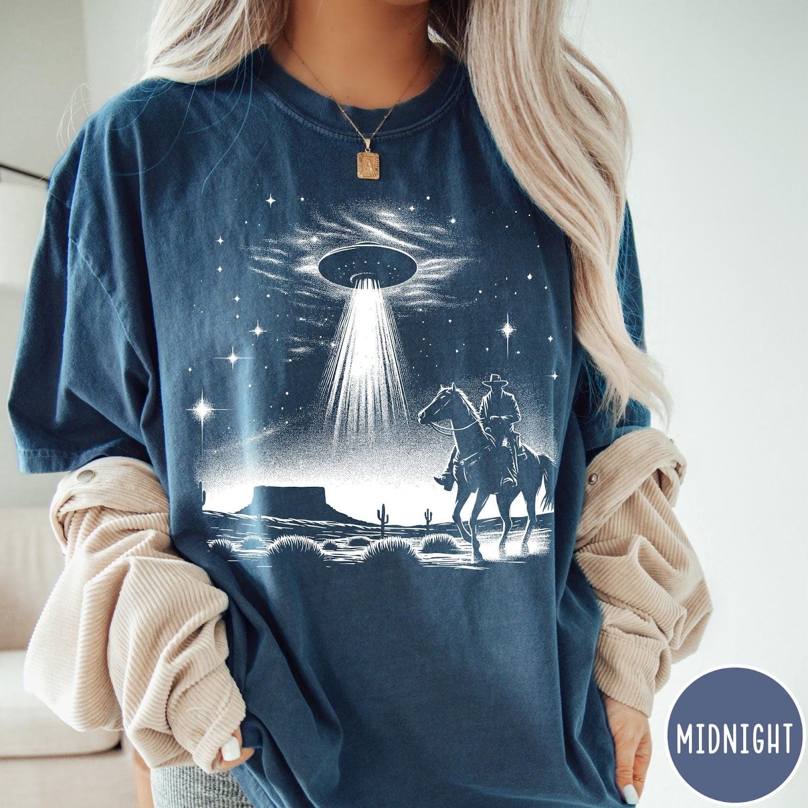 Comfort Colors tee in Midnight featuring western graphic style with a cowboy riding a horse under a UFO