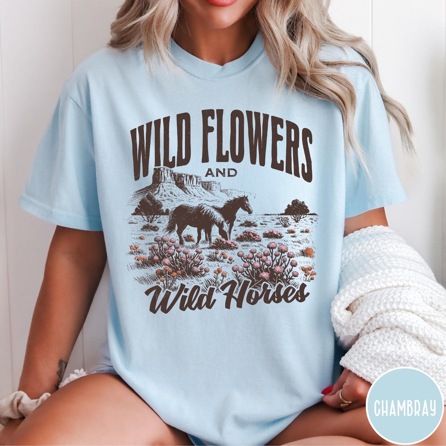 Comfort Colors tee in Chambray featuring western style graphic of wild horses grazing in a wildflower field