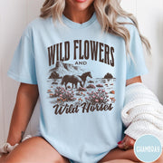 Comfort Colors tee in Chambray featuring western style graphic of wild horses grazing in a wildflower field