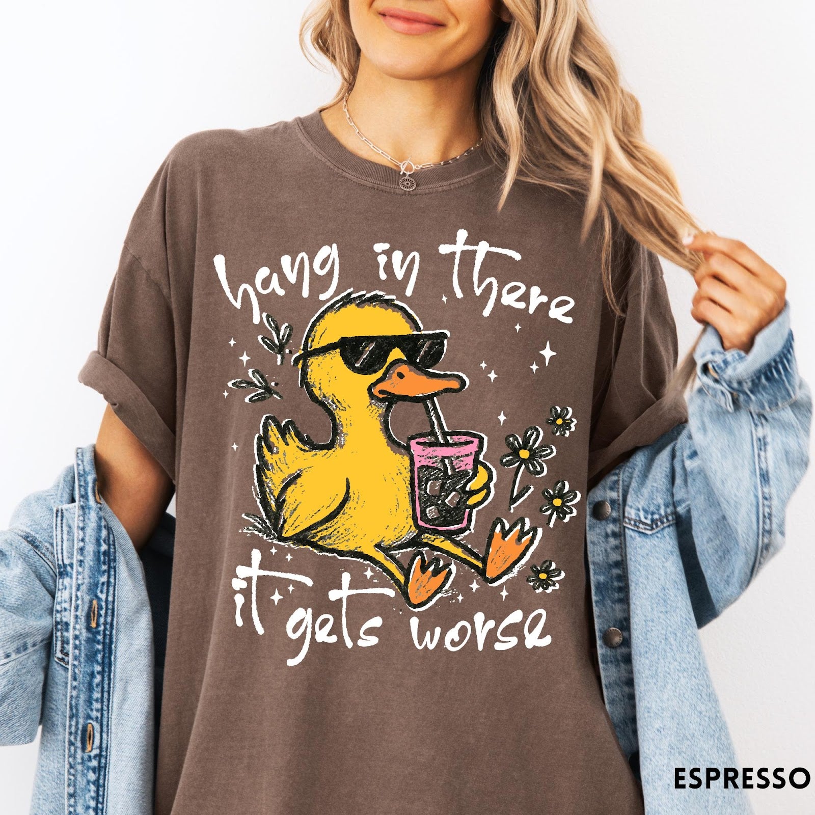 Comfort Colors tee in Espresso featuring illustrated duck wearing sunglasses and drinking iced coffee with floral accents