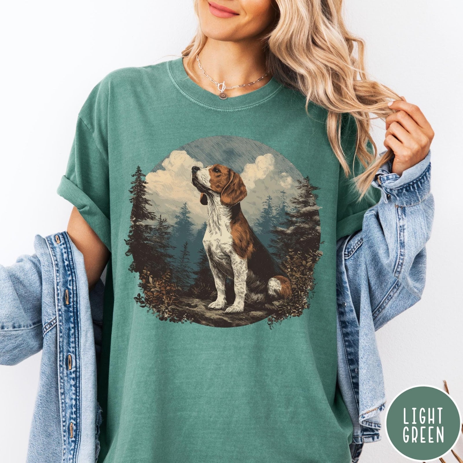 Comfort Colors tee in Light Green featuring vintage style graphic of a beagle sitting in a forest scene
