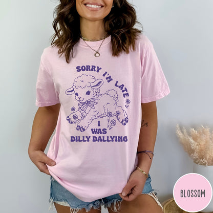 Comfort Colors tee in Blossom featuring line art graphic of a lamb with flowers and text