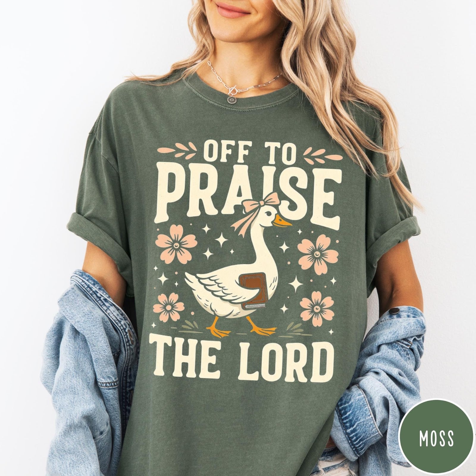 Comfort Colors tee in Moss featuring screen print style graphic of a goose carrying a book