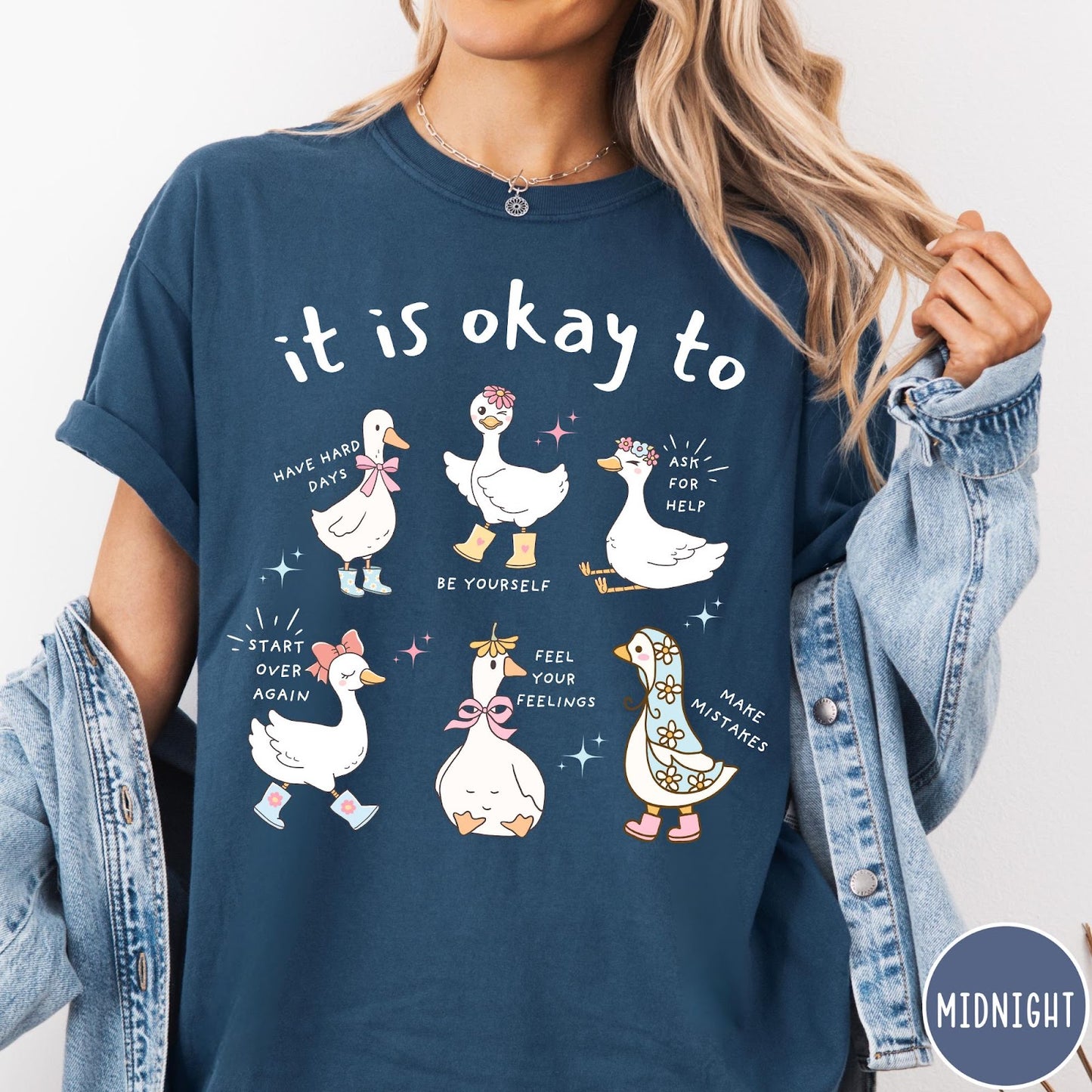 Comfort Colors tee in Midnight featuring whimsical graphic style with six cute geese and motivational text phrases