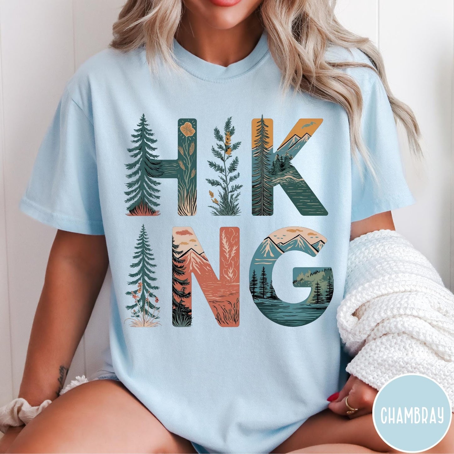 Comfort Colors tee in Chambray featuring nature graphic with trees and mountains inside the word Hiking
