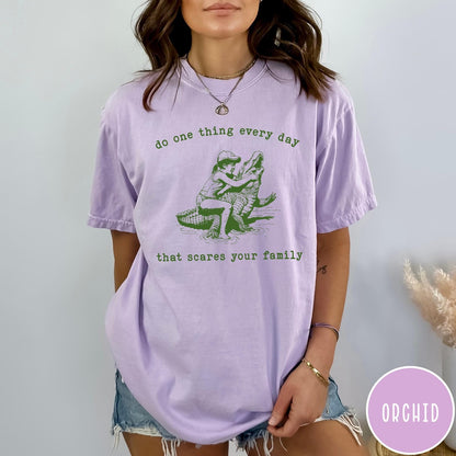 Comfort Colors tee in Orchid featuring vintage style graphic of a girl wrestling an alligator
