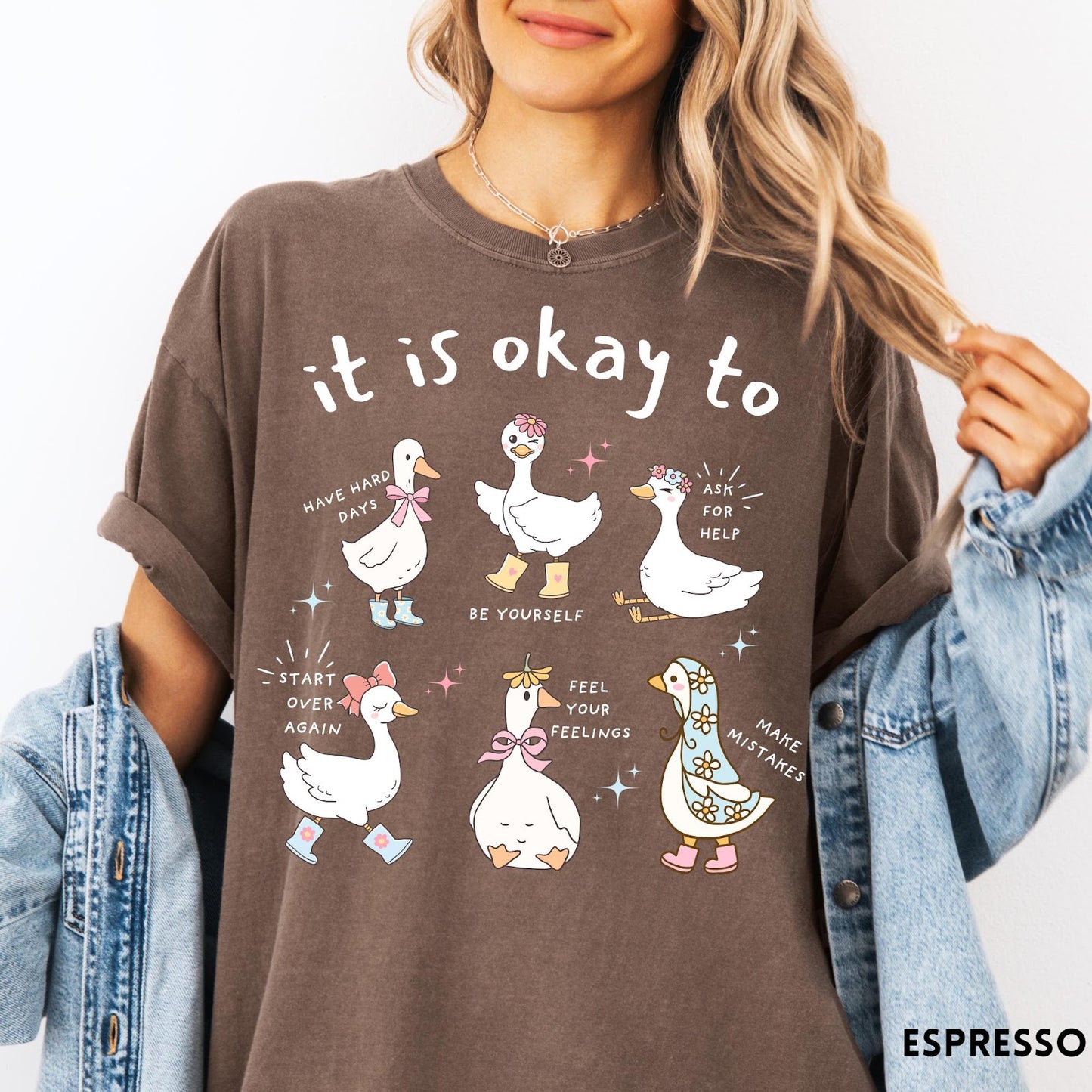Comfort Colors tee in Espresso featuring whimsical graphic style with six cute geese and motivational text phrases