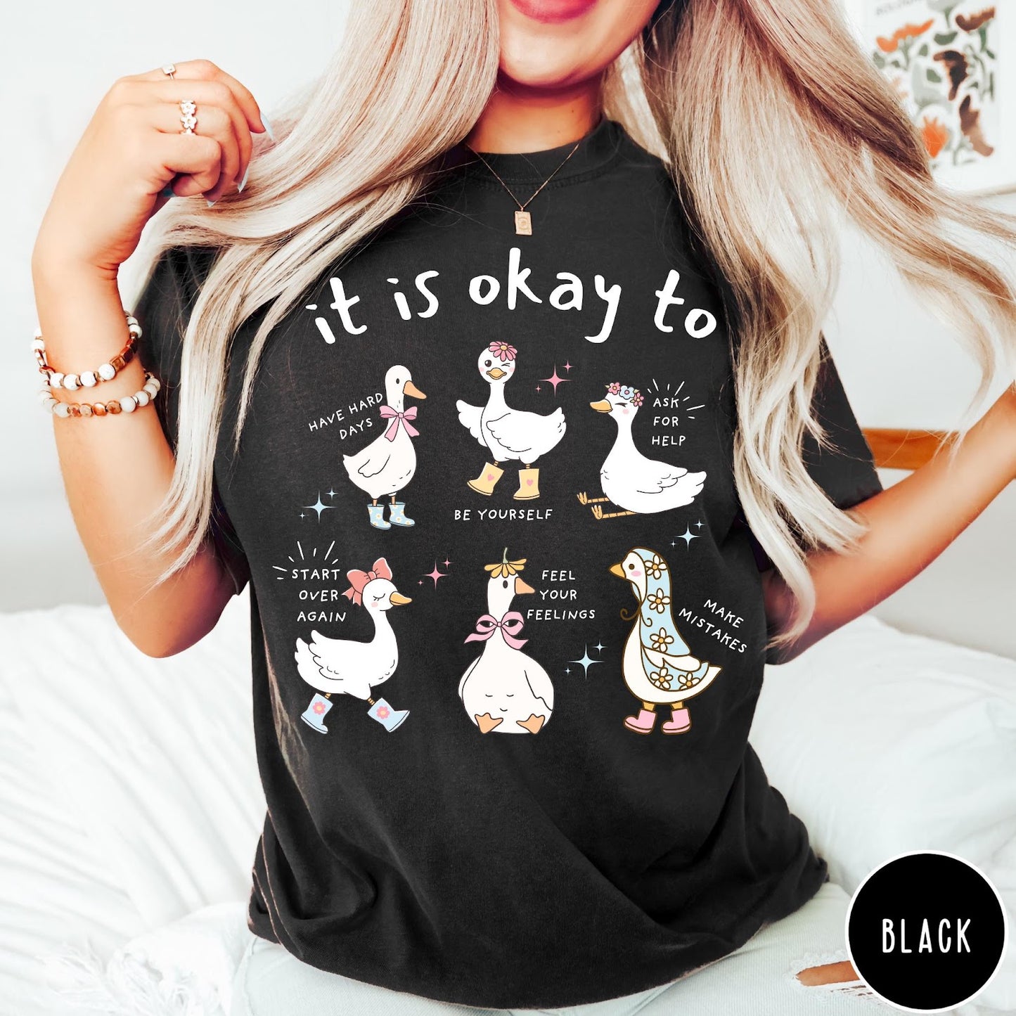 Comfort Colors tee in Black featuring whimsical graphic style with six cute geese and motivational text phrases