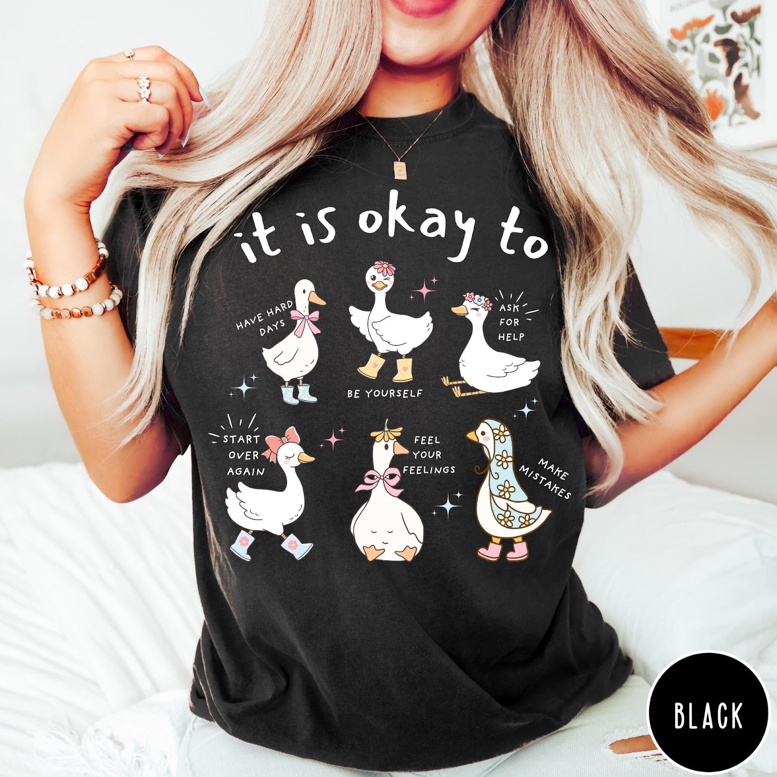 Comfort Colors tee in Black featuring whimsical graphic style with six cute geese and motivational text phrases