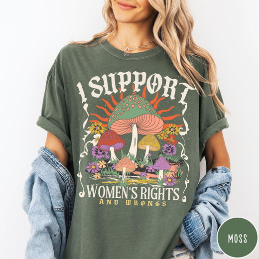 Comfort Colors tee in Moss featuring retro style graphic with mushrooms, flowers, and sun with inspirational text