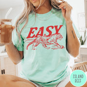 Comfort Colors tee in Island Reef featuring vintage style graphic of a walking tiger and text Easy