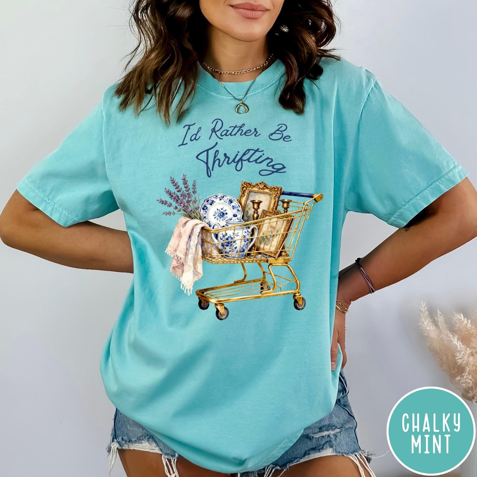 Comfort Colors tee in Chalky Mint featuring vintage decor graphic of a shopping cart filled with thrifted items