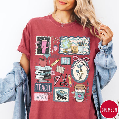 Comfort Colors tee in Crimson featuring collage style graphic with school supplies, books, and teacher life elements