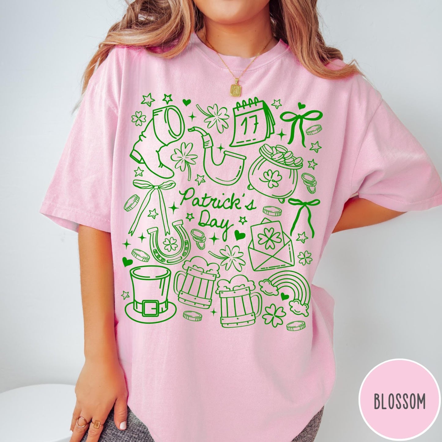 Comfort Colors tee in Blossom featuring line art style St. Patrick's Day icons and symbols