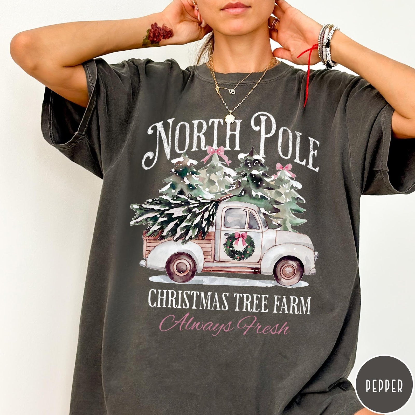 Comfort Colors tee in Pepper featuring vintage style Christmas tree farm truck graphic with snowy pine trees
