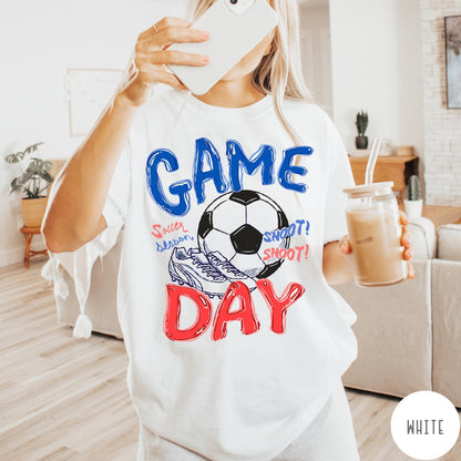 Comfort Colors tee in White featuring soccer graphic with ball, cleats, and Game Day typography design