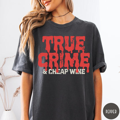 Comfort Colors tee in Pepper featuring red dripping text graphic that says True Crime and Cheap Wine