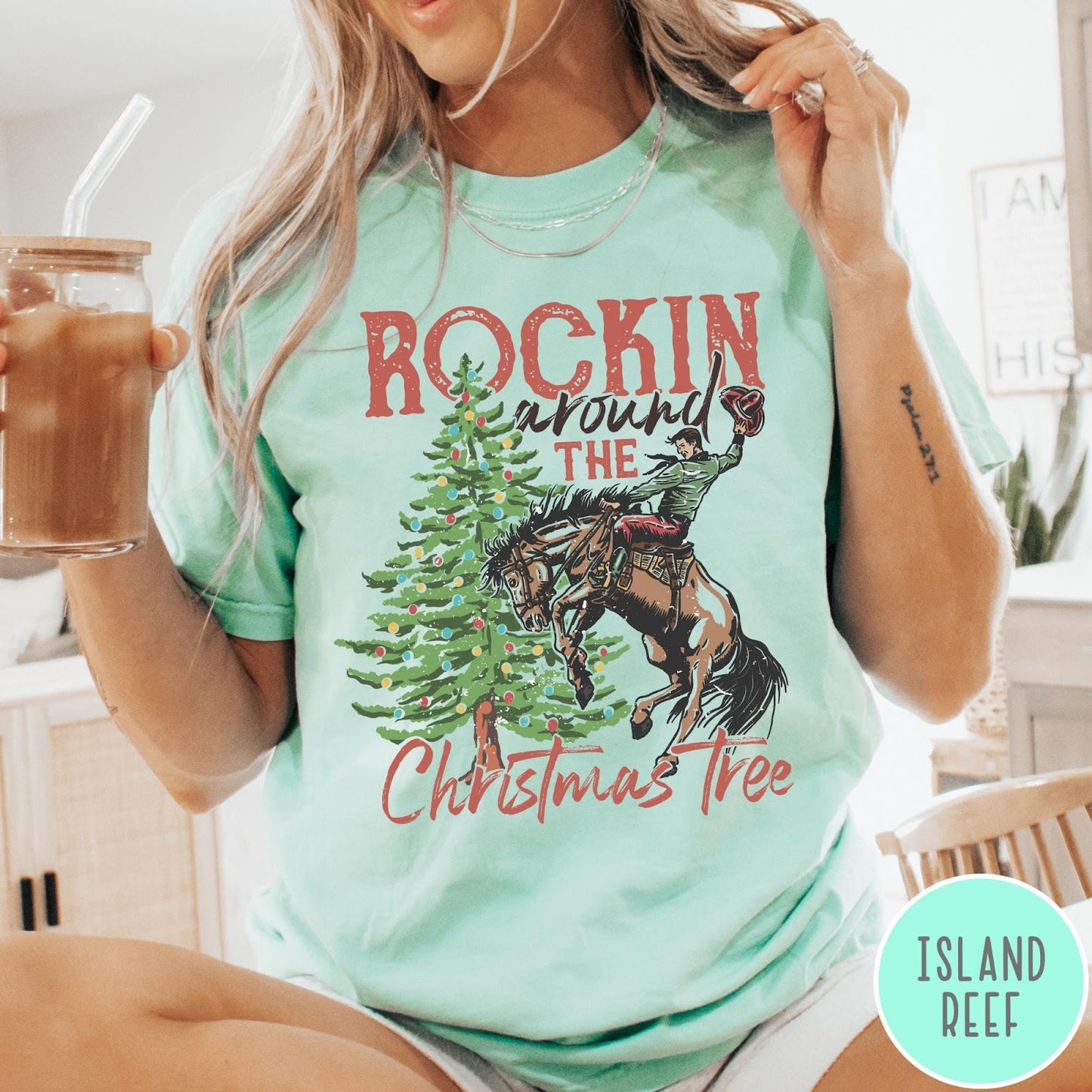 Comfort Colors tee in Island Reef featuring western graphic design of a cowboy on a bucking horse Christmas tree