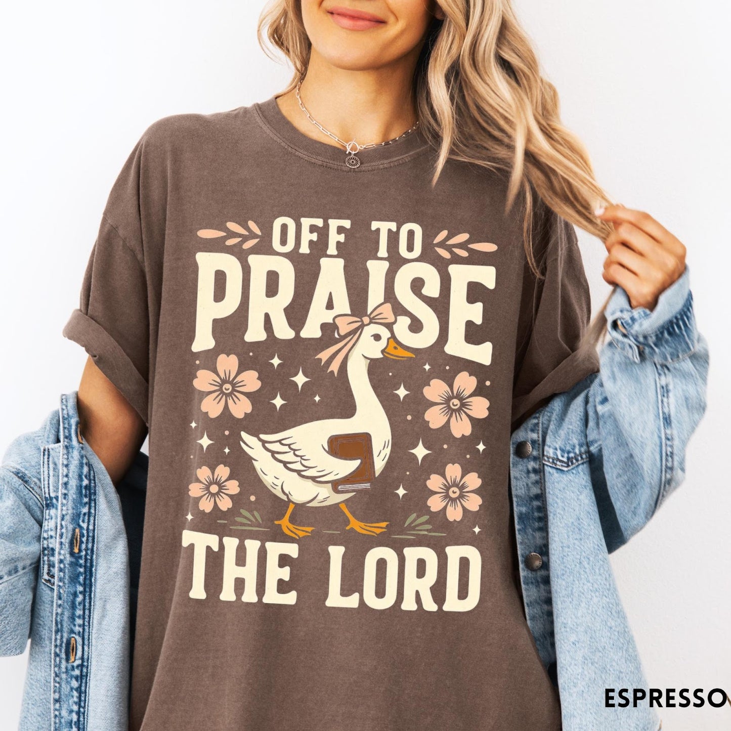 Comfort Colors tee in Espresso featuring retro style graphic of a goose wearing a bow holding a book