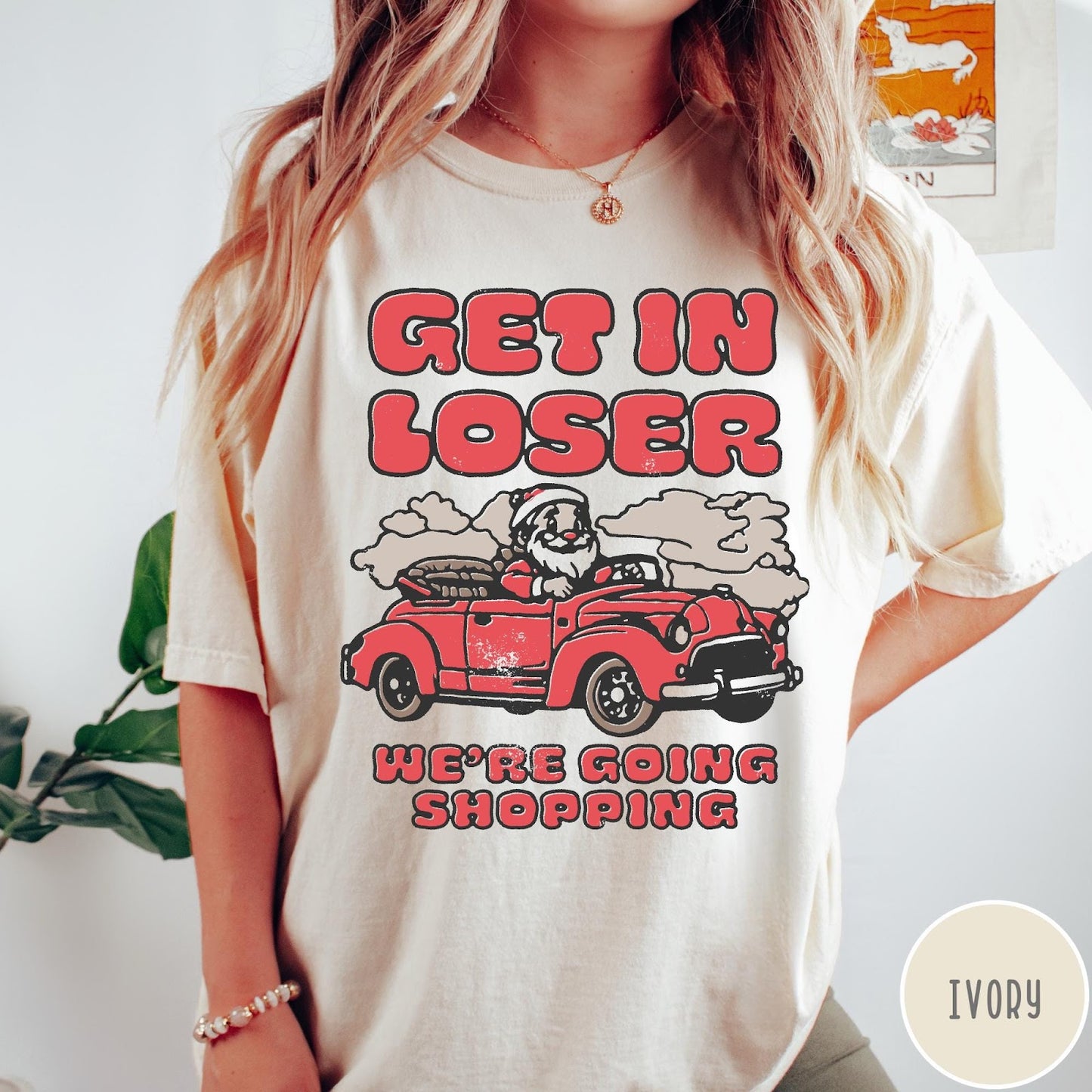 Comfort Colors tee in Ivory featuring retro style graphic of Santa Claus driving a red convertible car