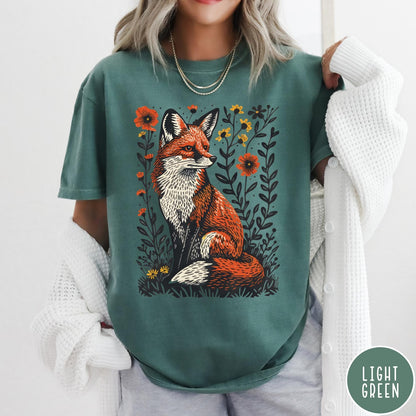 Comfort Colors tee in Light Green featuring vintage style graphic of a sitting fox surrounded by orange flowers