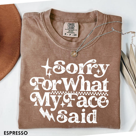 Comfort Colors tee in Espresso featuring sarcastic expression graphic with Sorry For What My Face Said text