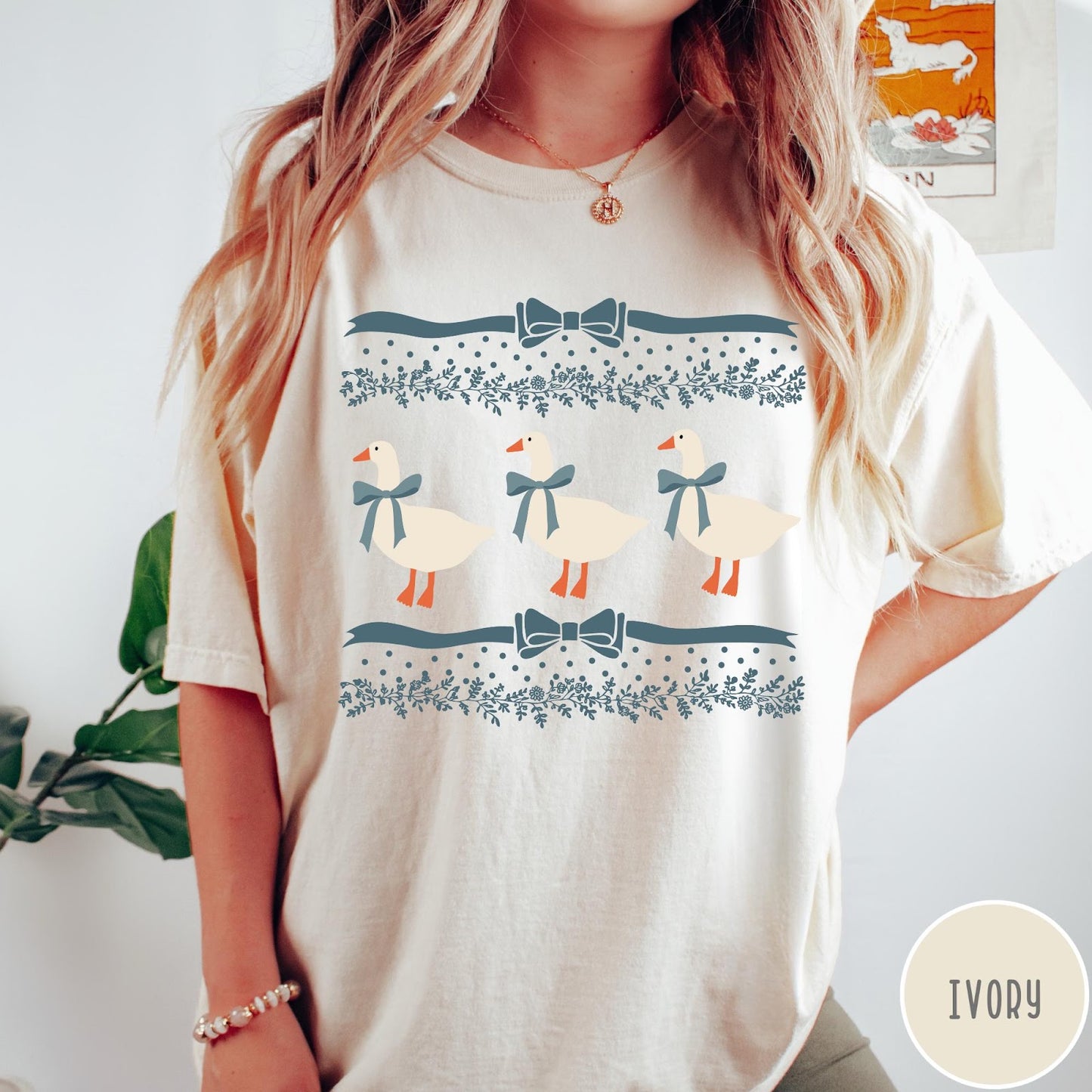 Comfort Colors tee in Ivory featuring vintage style graphic with three geese wearing blue ribbons and floral borders