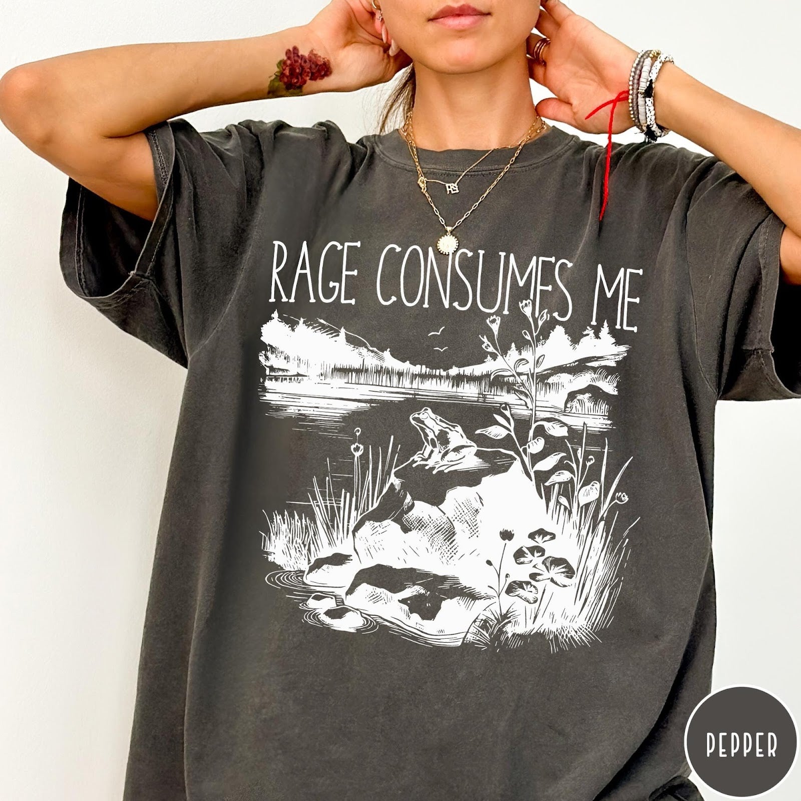 Comfort Colors tee in Pepper featuring screen printed nature graphic with a frog sitting on a rock