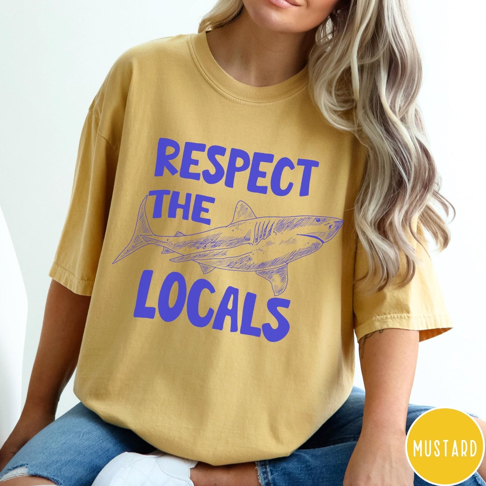 Comfort Colors tee in Mustard featuring sketch style shark graphic with Respect the Locals text design