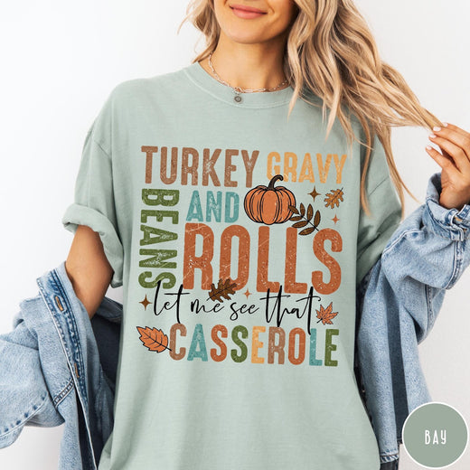 Comfort Colors tee in Bay featuring vintage style Thanksgiving graphic with turkey, gravy, rolls, and casserole text